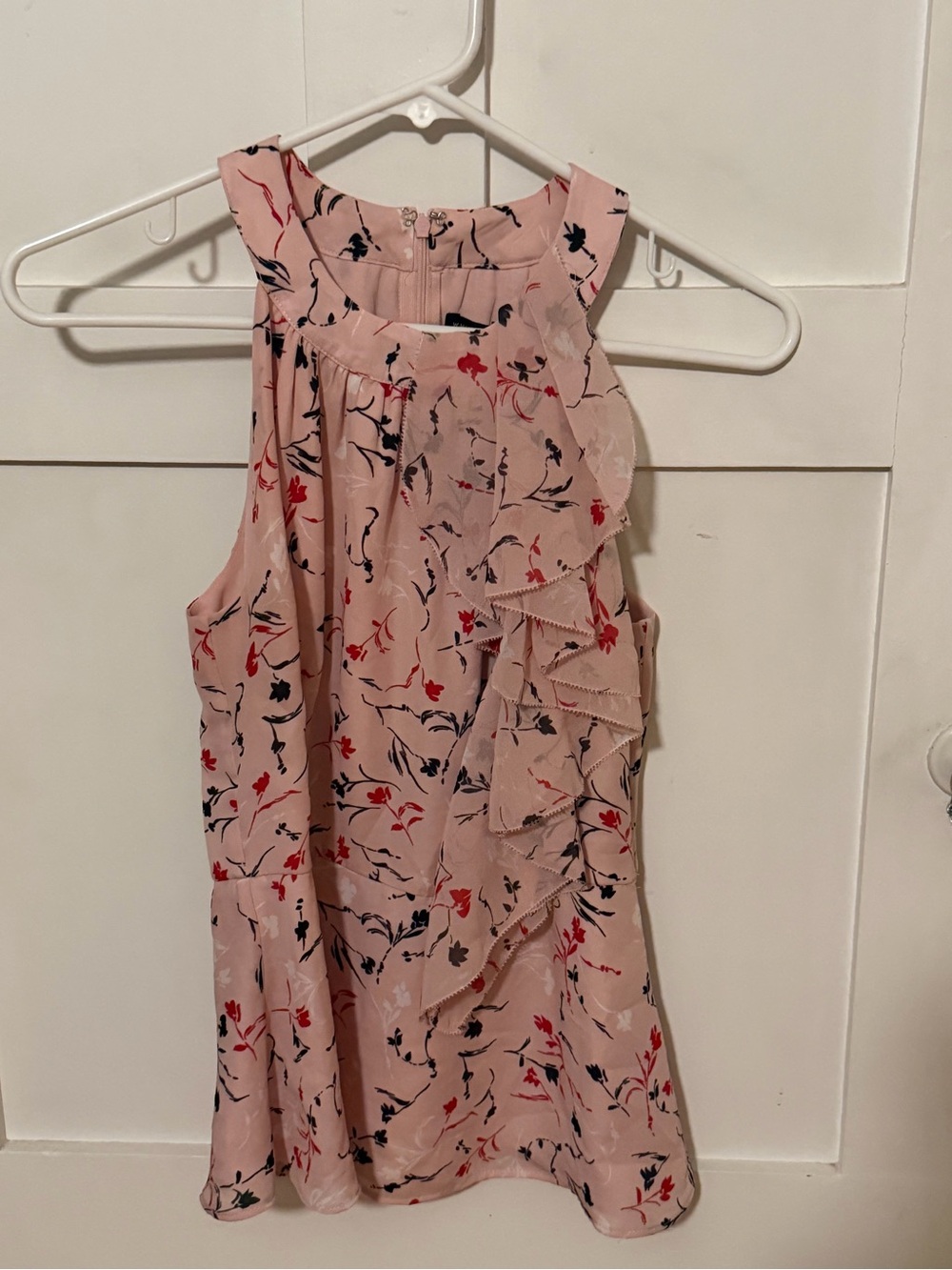 Woman’s White House black market sleeveless blouse with side ruffle size 2